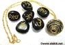 Picture of Black Sanskrit Tumble stone set with golden cage necklace, Picture 1