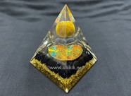 Show details for Black Nubian Orgone Pyramid with Floating Tiger Eye Ball Picture of Black Nubian Orgone Pyramid with Floating Tiger Eye Ball